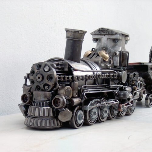 Train artwork made of scrap metal parts